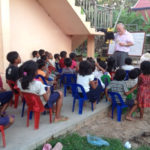 Joe Crow and Peter sharing the tract in the village